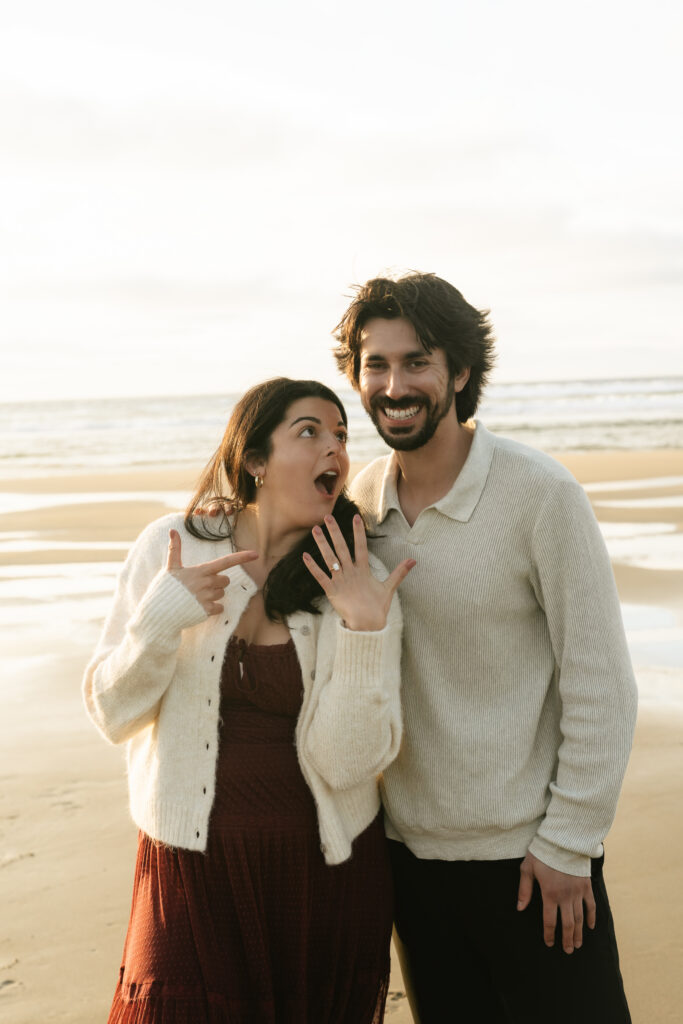 Joyful couple smiling close together at sunset